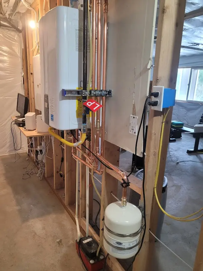 Licensed plumber repairing a kitchen sink in Pierre
